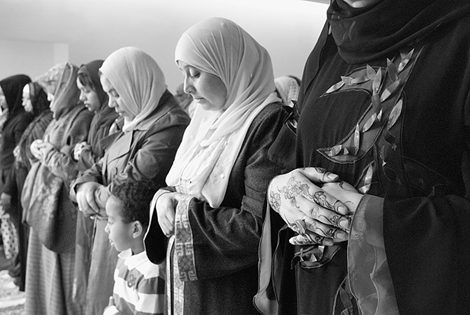 Muslim women pray during the Eid Holiday. Learn more about Arab American contributions to American history in the new American History database's Topic Center Arab-American History.