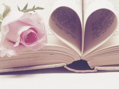 Valentine's Day, rose and heart-shaped pages in book