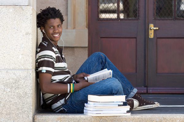 Young researcher in front of library