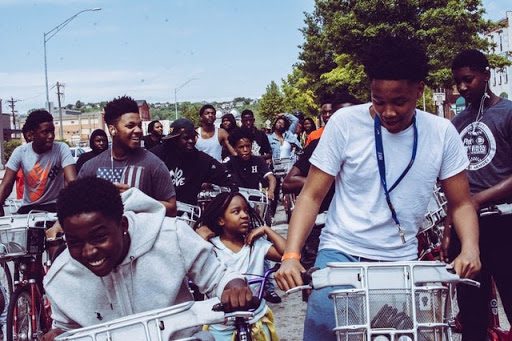 Young people on a bicycle ride, an example of how to celebrate Juneteenth