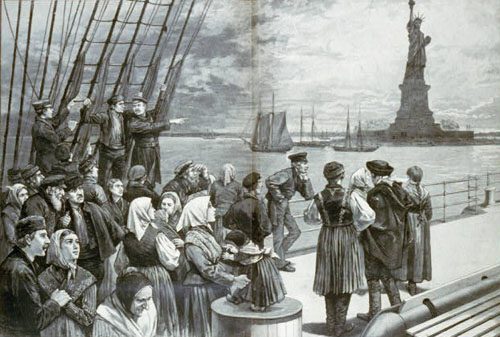 A ship passes the Statue of Liberty as it transports immigrants to Ellis Island in New York harbor.