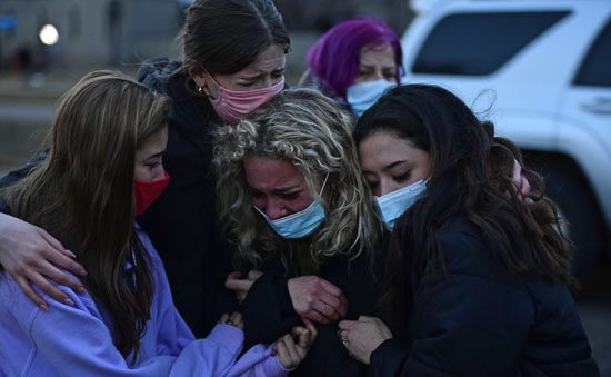 Mourners after shooting at Kings Soopers in Boulder, Colorado