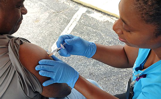 Nurse giving man an injection
