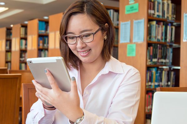 Librarian using social media in her library