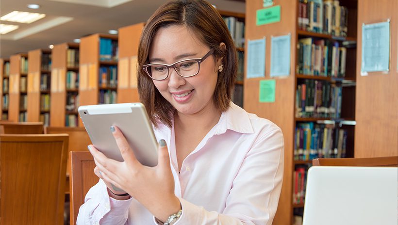 Librarian using social media in her library