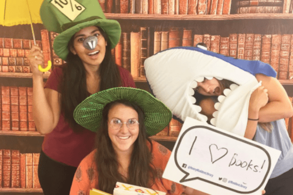 Librarians wearing costumes during library orientation