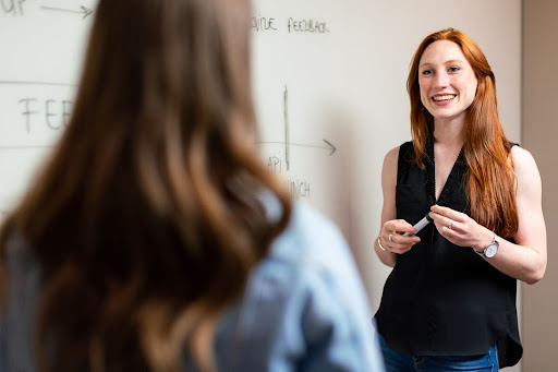 Teacher in front of whiteboard