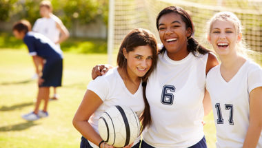College students on a soccer team, as playing on a sports team is a good way to develop soft skills