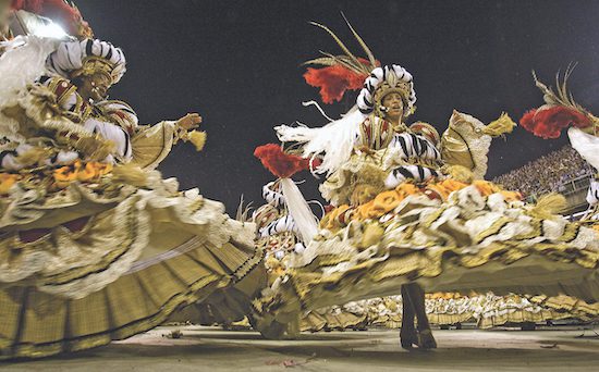 Academicos do Salgueiro samba school dancers perform along the Sambadrome during Rio’s Carnival celebration in 2009
