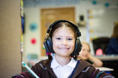 Young student with big headphones