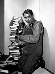 Burgess Meredith with books