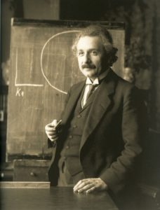 Albert Einstein at chalkboard