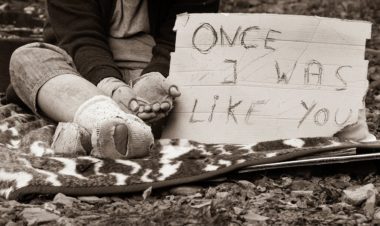 Homeless man with sign "Once I was like you"